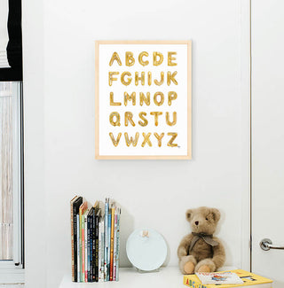 Gold Balloon Alphabet from The Letter Nest, Natural Frame installed in nursery