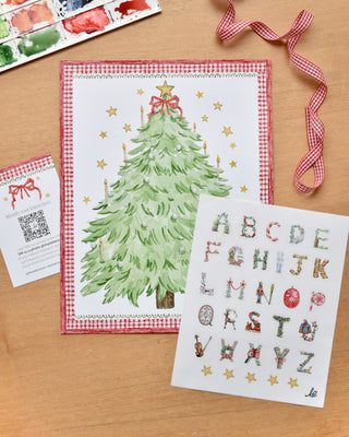 style flatlay photo of The Letter Nest's Advent Alphabet Calendar with sticker sheet and insert card 