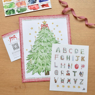 Flatlay photo of the Advent Alphabet Calendar by The Letter Nest, including a print, sticker sheet, and insert card.