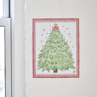 Advent Alphabet Print from The Letter Nest hanging in a sunlit corner against a white brick wall