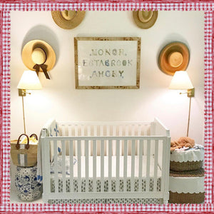 Custom Full Name Print for "Honor Estabrook Amory" hung up in her nursery above a white crib and surrounded by hats