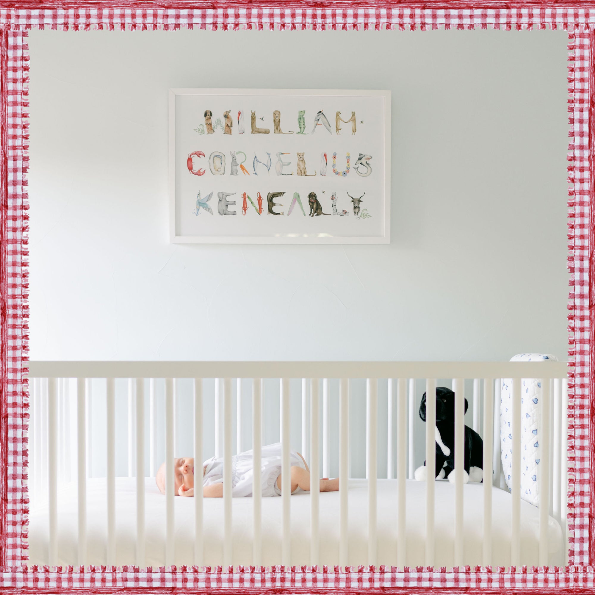 Animal Full Name Print installed in a nursery with a sleeping baby