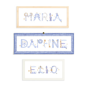 Custom Astrology Name Print by The Letter Nest shown in flatlay in various border options