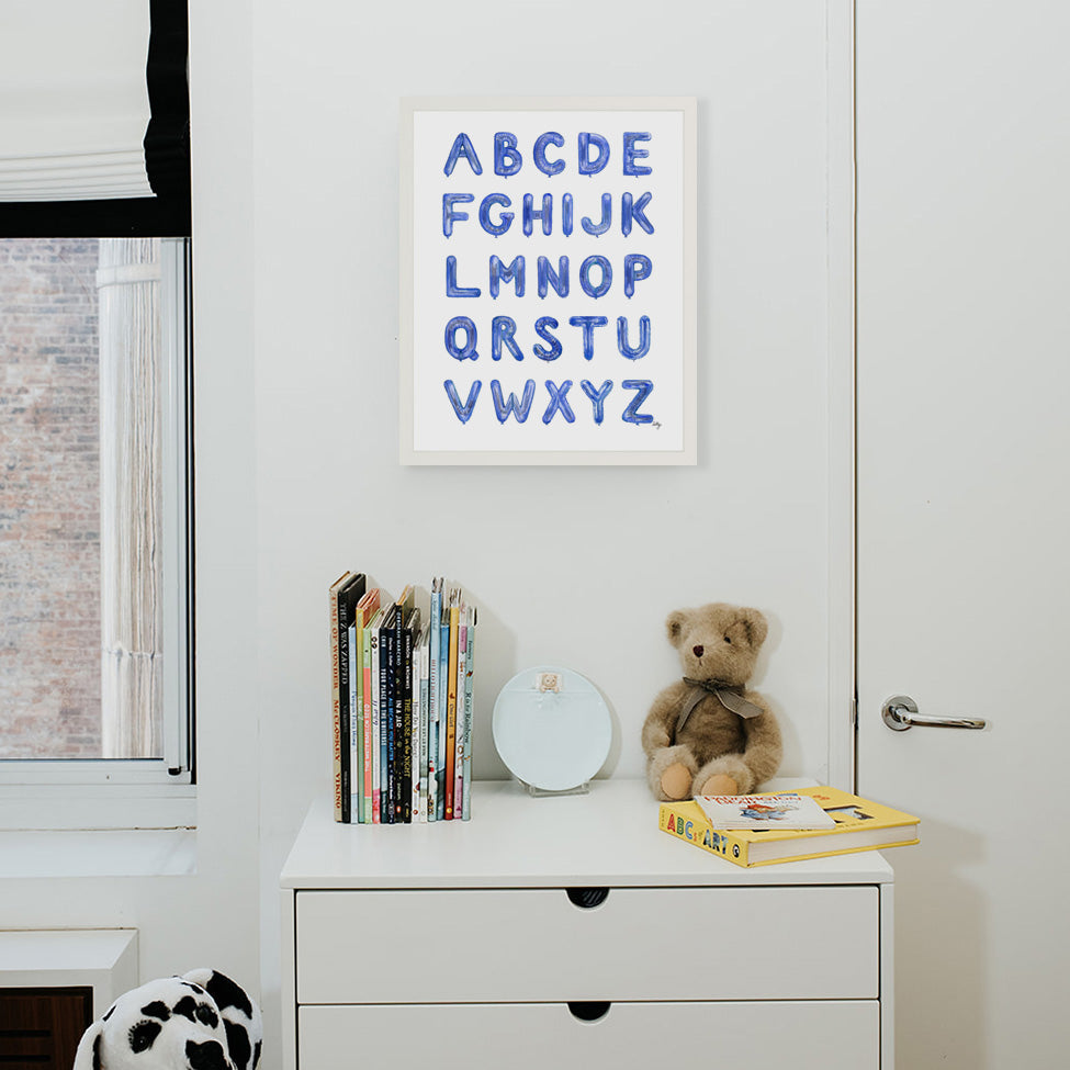 Blue Balloon Alphabet from The Letter Nest, White Frame installed in nursery