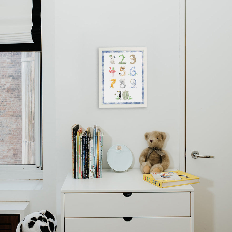 Animal Number print with blue gingham border from The Letter Nest, White Frame installed in nursery