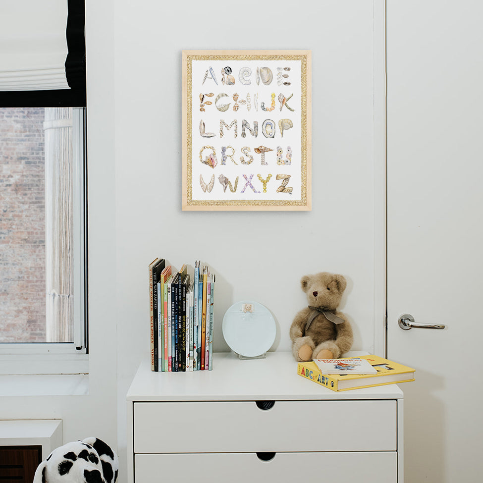 Shell Alphabet with Braided Rope border, shown in a Natural Frame installed in nursery