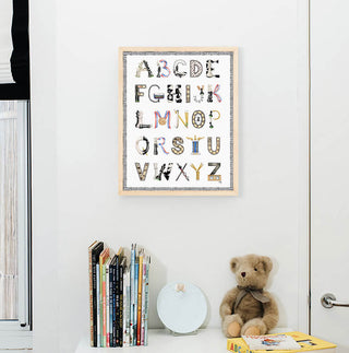 Chess Alphabet with Black Gingham Border and Natural Frame hanging in a nursery