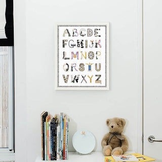 Chess Alphabet with Black Gingham Border and White Frame hanging in a nursery