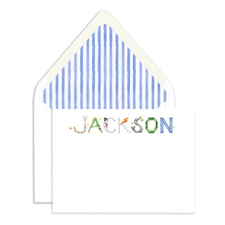 Personalized Circus Stationer by The Letter Nest in name "Jackson" against an envelope with blue stripe liner