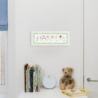 Flower Custom Name Print spelling "Harper" in flower letters by The Letter Nest in a white frame with vine border