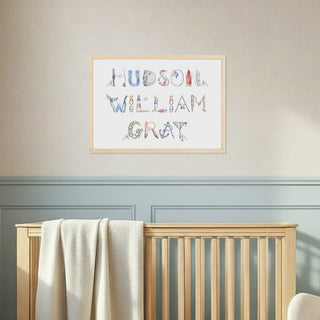 Nautical Themed Name Print in an elegant nursery with light blue painted walls, in name "Hudson William Gray" in a natural wood frame