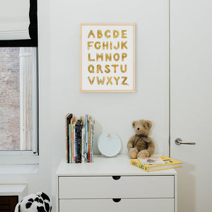 Gold Balooon Alphabet from The Letter Nest, Natural Frame installed in nursery