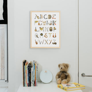 Musical Instruments Alphabet Print by The Letter Nest in a Natural Frame installed in a nursery