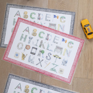 New York City Alphabet Placemats shown in red and black gingham borders