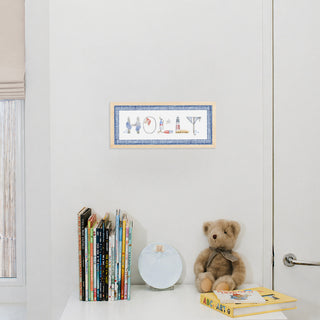Nautical Custom Name Print by The Letter Nest in a natural frame in name "Holly" with gingham blue border, hung up in nursery