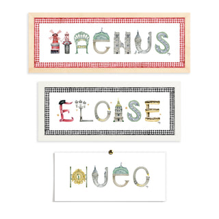 Custom Paris Name Prints by The Letter Nest in flatlay with various border and frame options