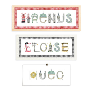 Custom Paris Name Prints by The Letter Nest in flatlay with various border and frame options