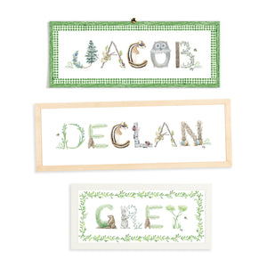 Custom Woodland Name Prints by The Letter Nest in flatlay showing various borders and frame options