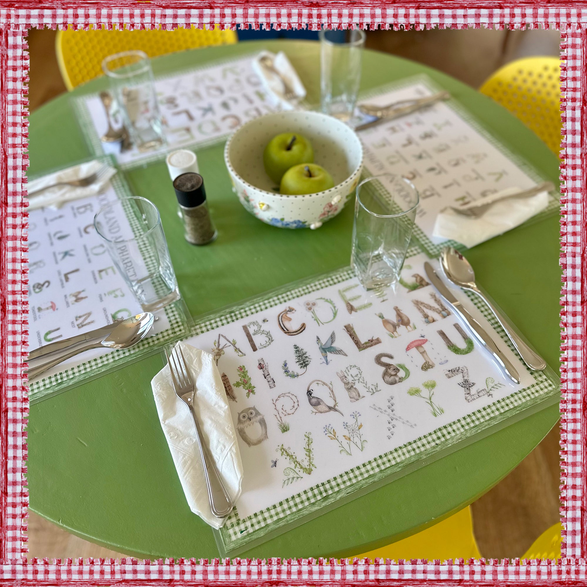 Woodland Alphabet Placemat with green gingham border and letter key on the verso of the placemat