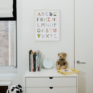 Construction Alphabet from The Letter Nest, White Frame installed in nursery