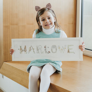 Marlowe holding her Custom Woodland Name Print